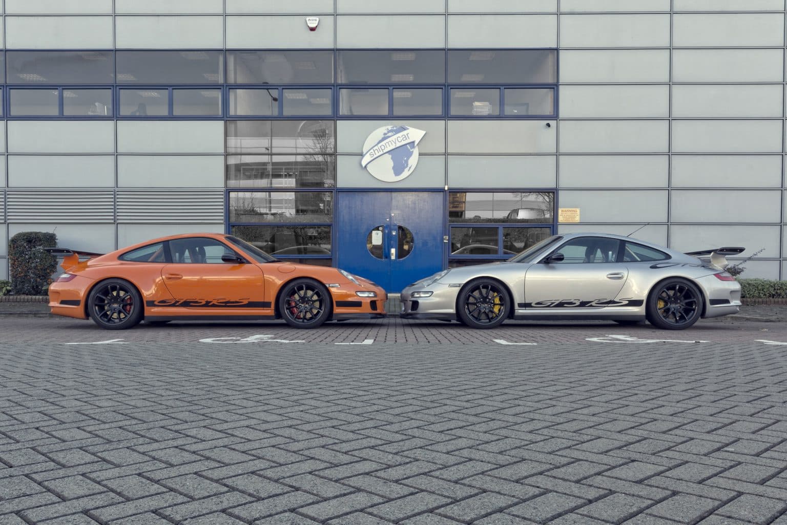 ShipMyCar workshop with various cars